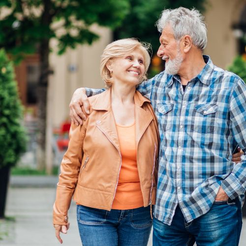 older married couple enjoying life on a walk