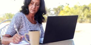 woman researching wound care specialist on computer